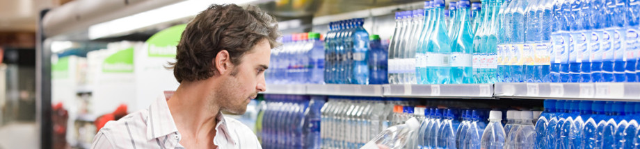 Father and child in supermarket --- Image by © Image Source/Corbis